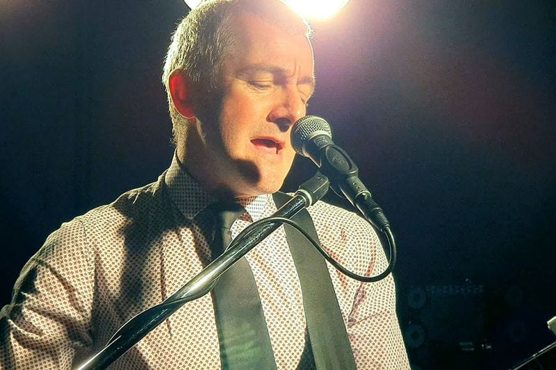 Live acoustic performance at a wedding reception